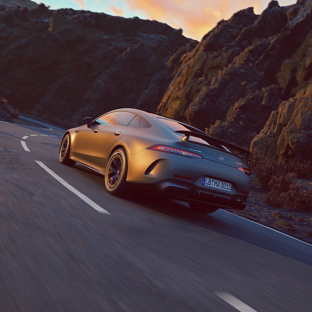 The optional AMG Aerodynamics Package for the Mercedes-AMG GT 63 S E PERFORMANCE (for example fixed rear wing) or driving shot, seen from the rear end with fixed rear wing.