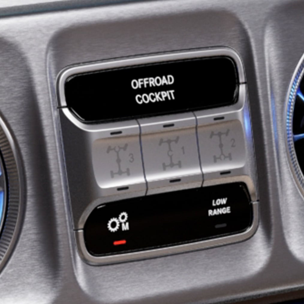 Close-up of the OFFROAD cockpit of a G-Class with the 3 switches for the differential locks.