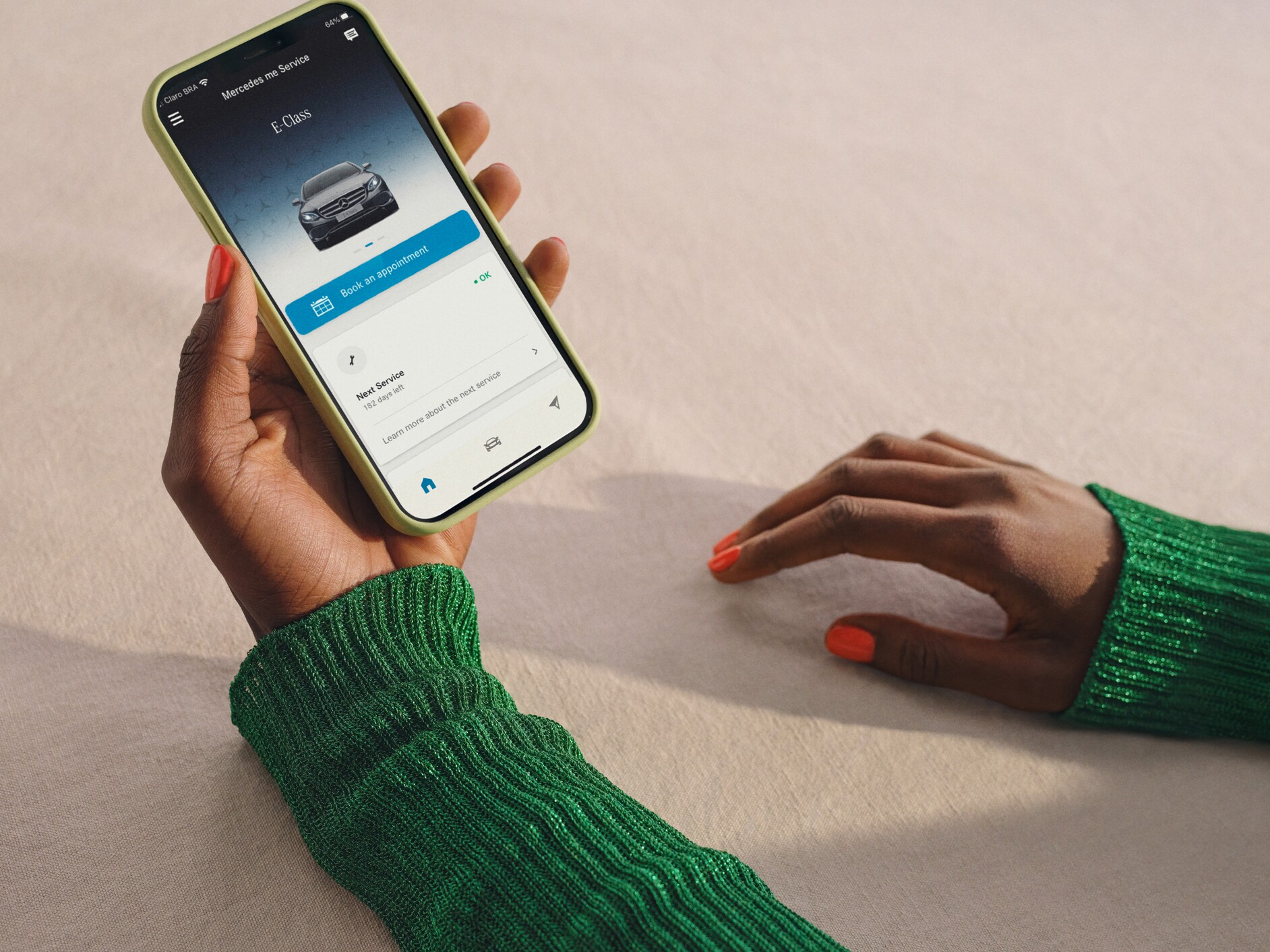 A notification of pending maintenance is visible on the smartphone.