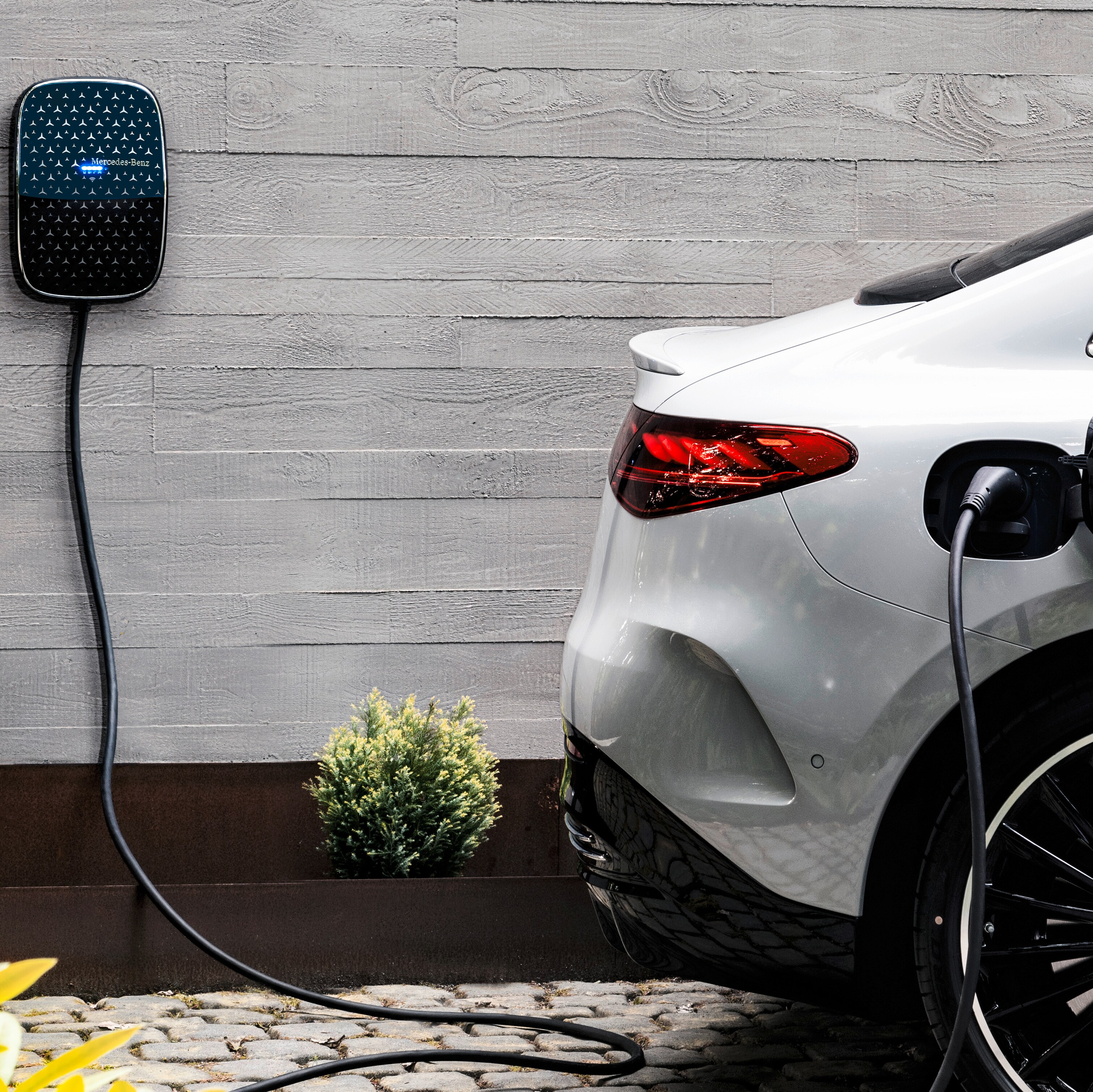A Mercedes-Benz EQE charging at a Wallbox