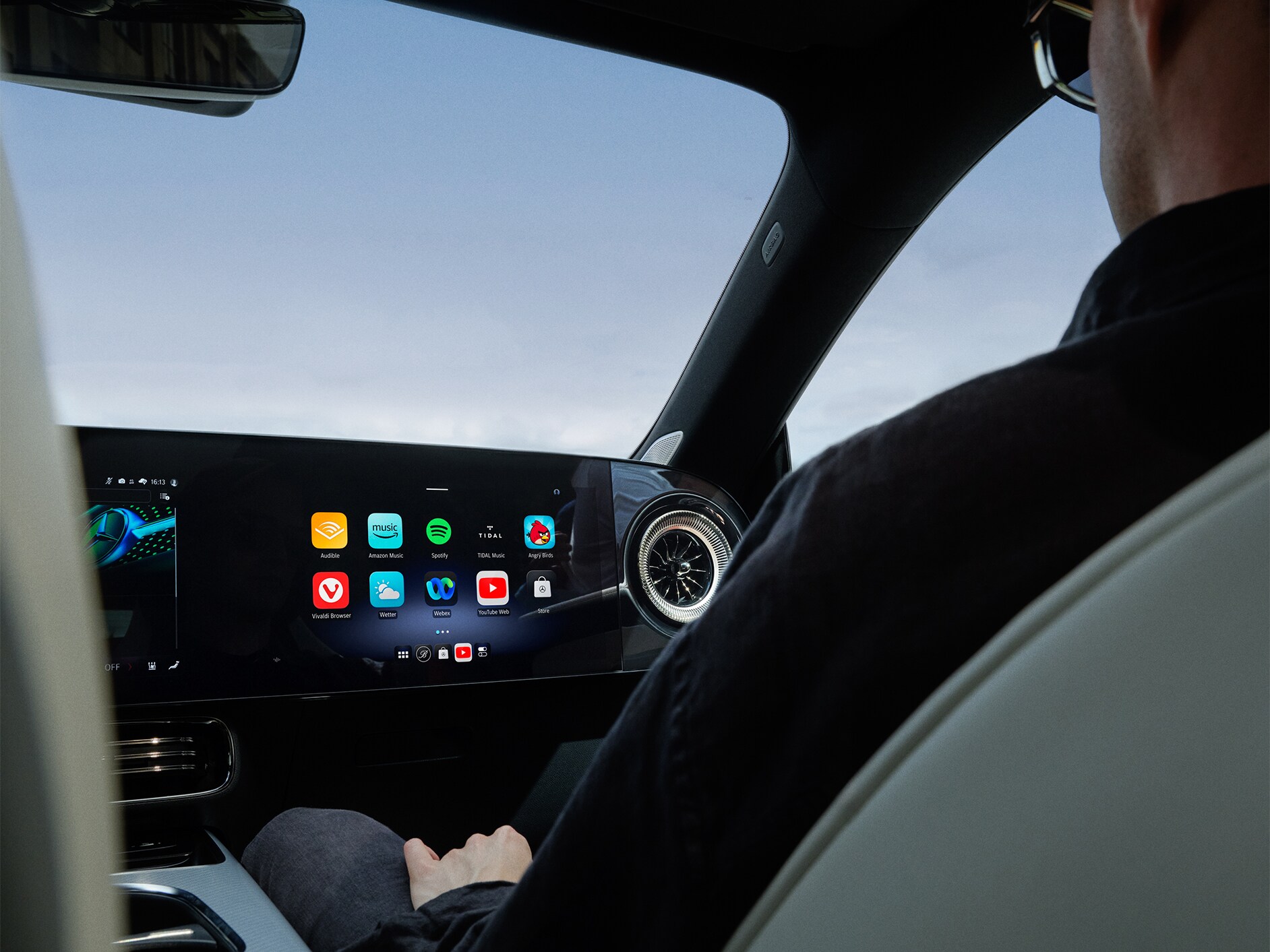 Interior view of an Mercedes-Benz car cockpit with MBUX Multimedia System. 