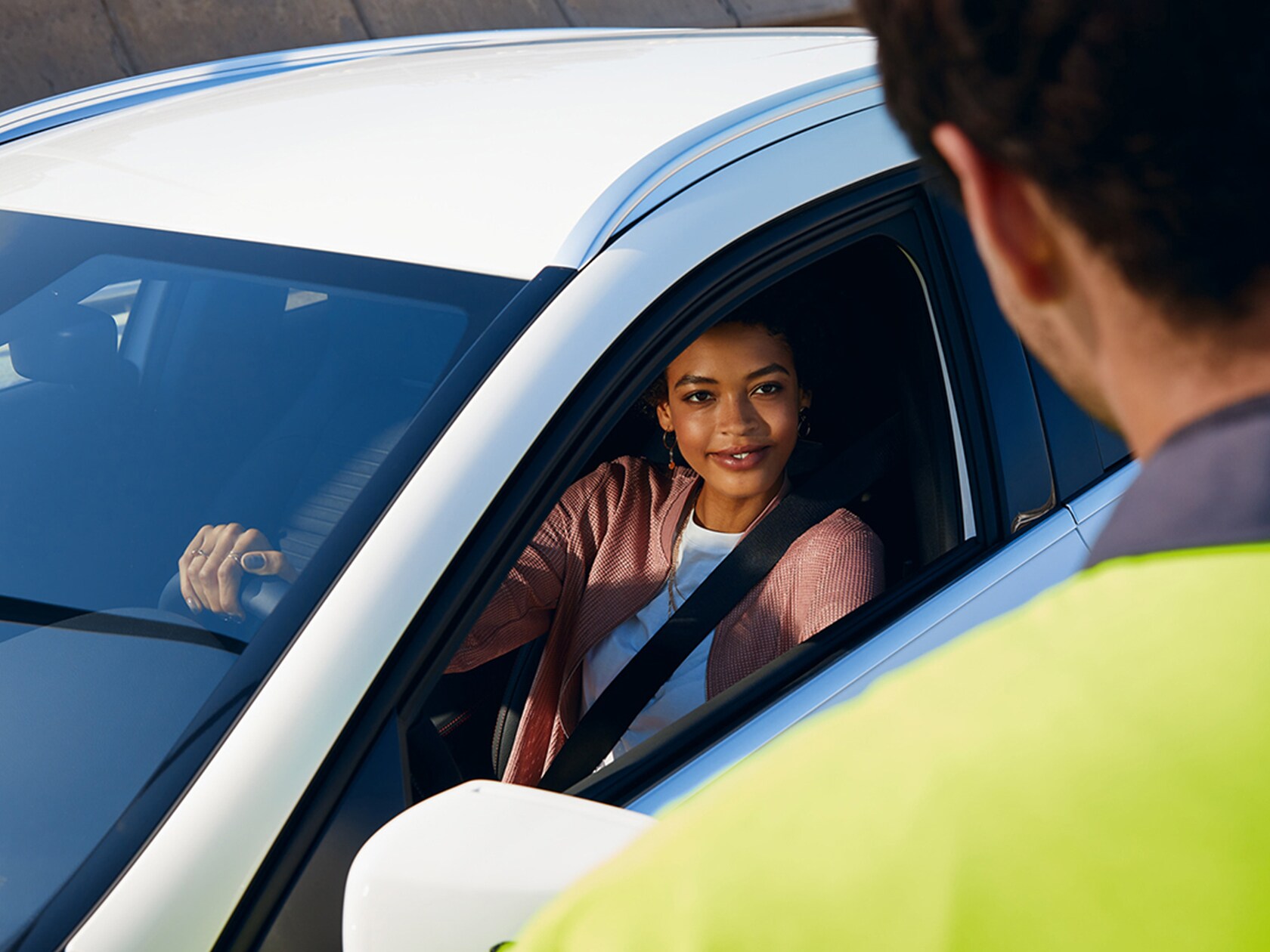 A woman is looking at her digital service report on her tablet.