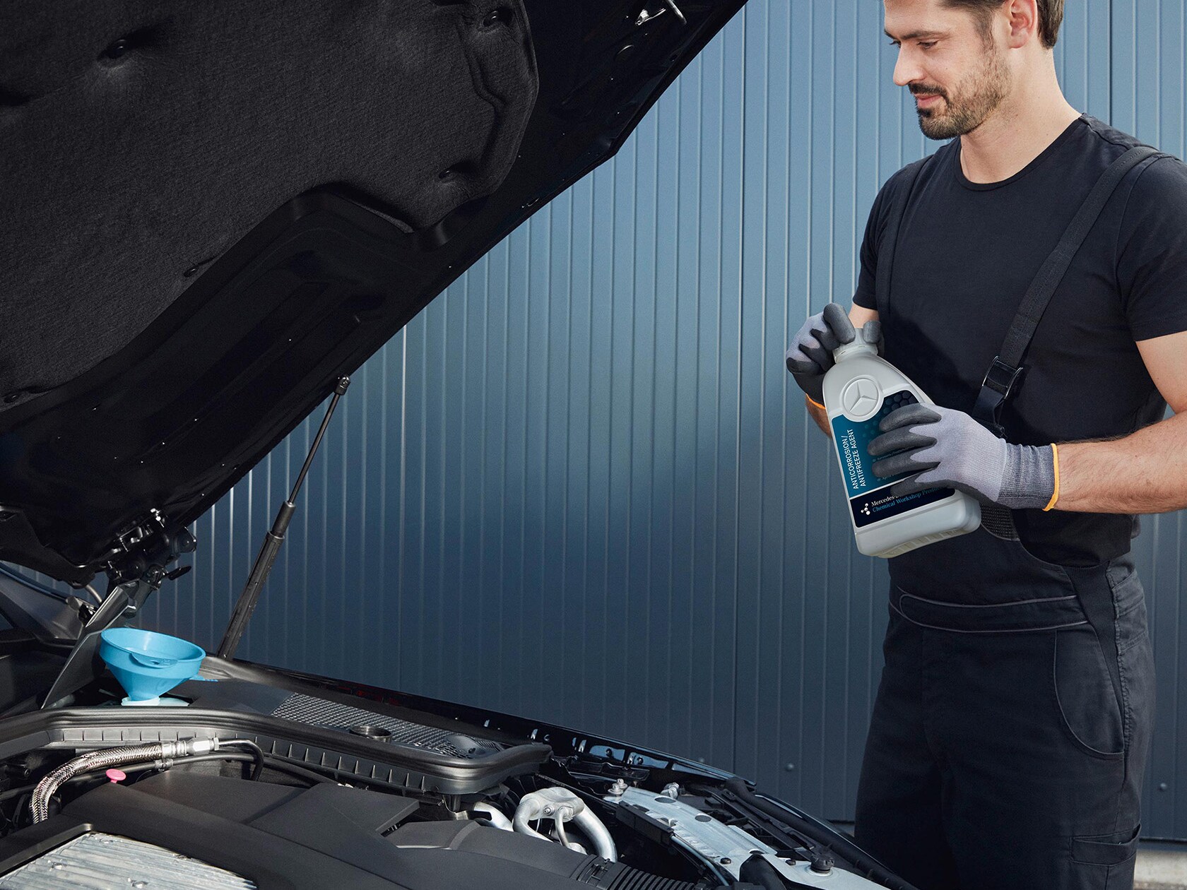 A Mercedes-Benz technician checks a vehicle on the test bench.