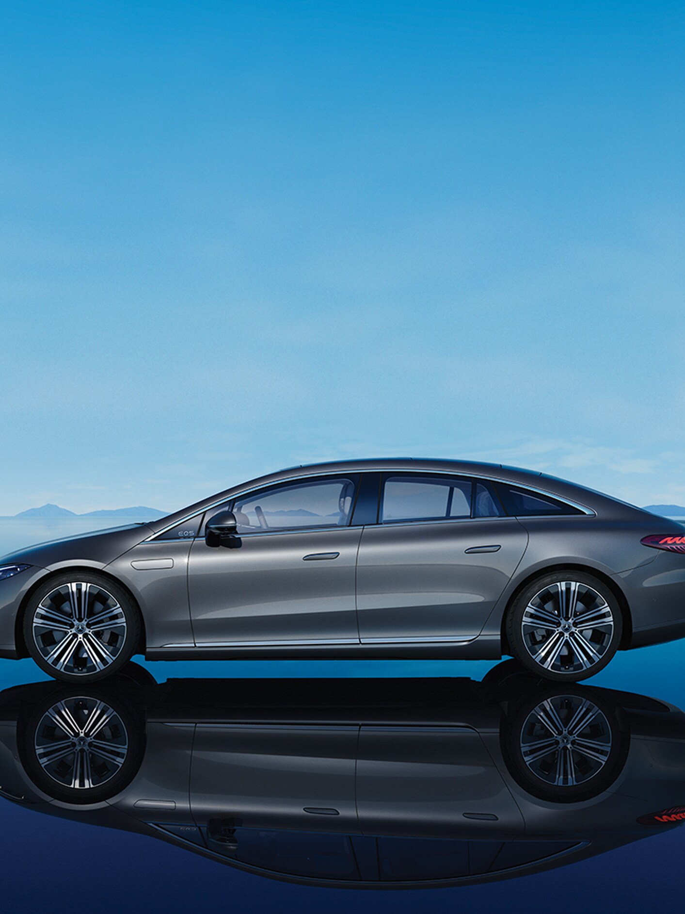 The image shows a side view of the EQS SUV from Mercedes-EQ.