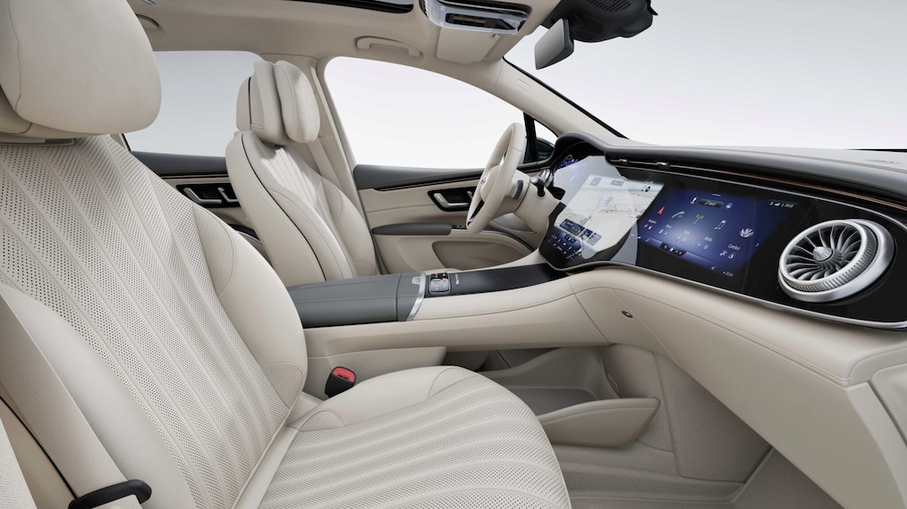 A view of the two rear rows of seats of the EQS SUV with the rear side door open.