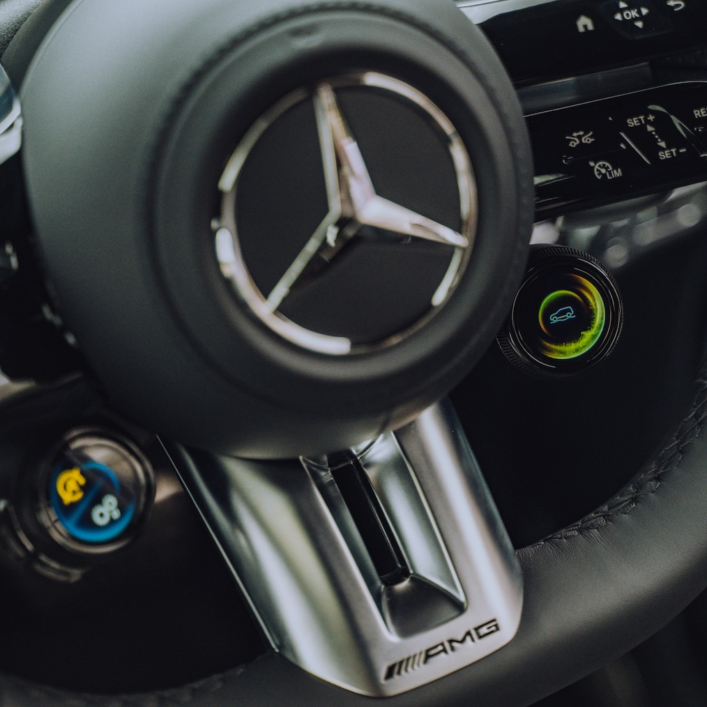 Close-up of Mercedes AMG steering wheel.